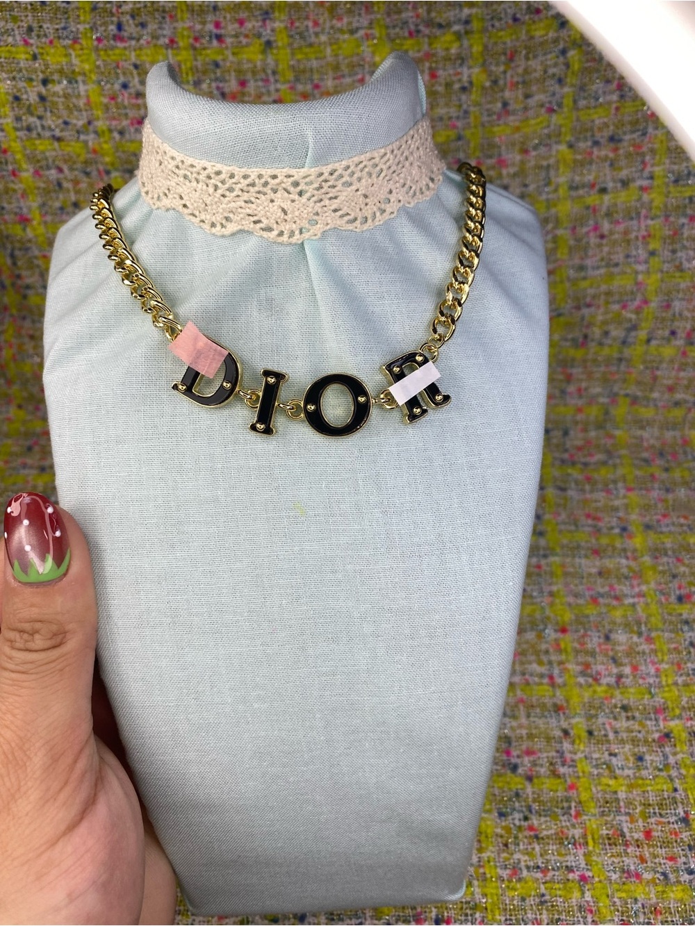 A great Gold and Black Letter Chain Necklace